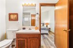 Main Level Primary Bedroom attached bathroom at Sandcastle Spirit